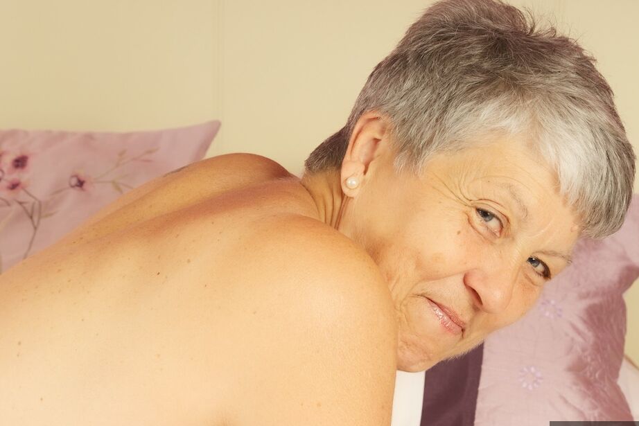 20P Short-haired nan Savana gets naked on a bed with panties around stiletto heels