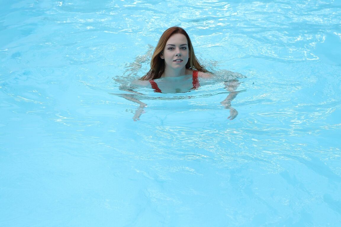 21P Sweet amateur with big tits Candy Red gets banged beside the indoor pool