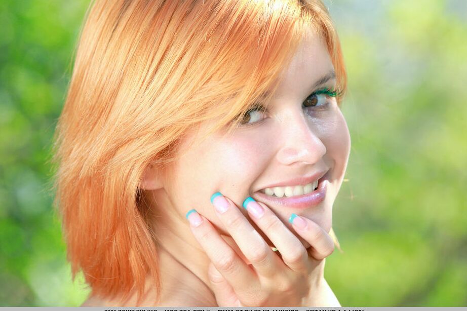 18P Beautiful redhead Violla A removes her clothes on a country lane to pose nude