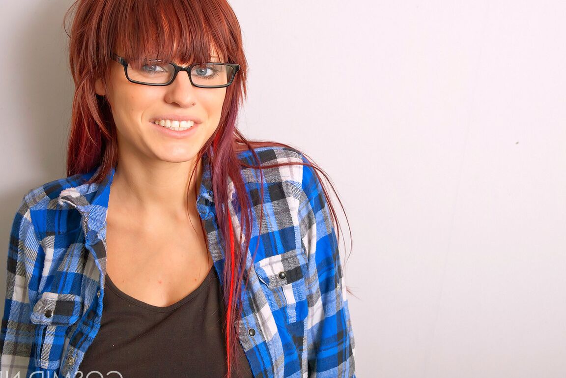 16P Redheaded nerd exposes her nice melons after donning micro skirt in glasses