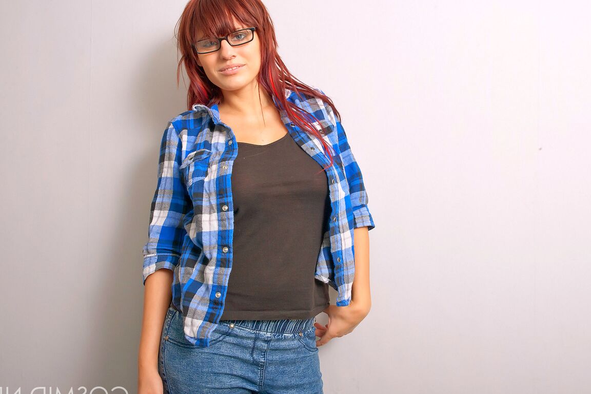 16P Redheaded nerd exposes her nice melons after donning micro skirt in glasses