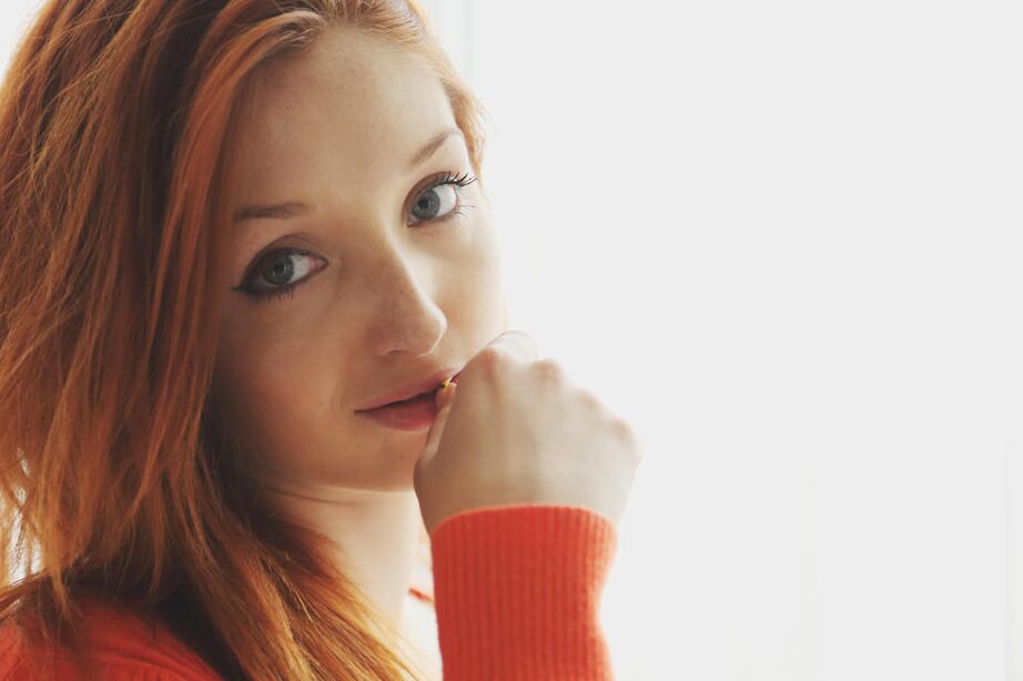16P Beautiful ginger Micca shows her goodies while posing on the chair