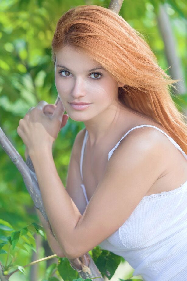 18P Beautiful redhead Violla A strikes confident nude poses amid trees