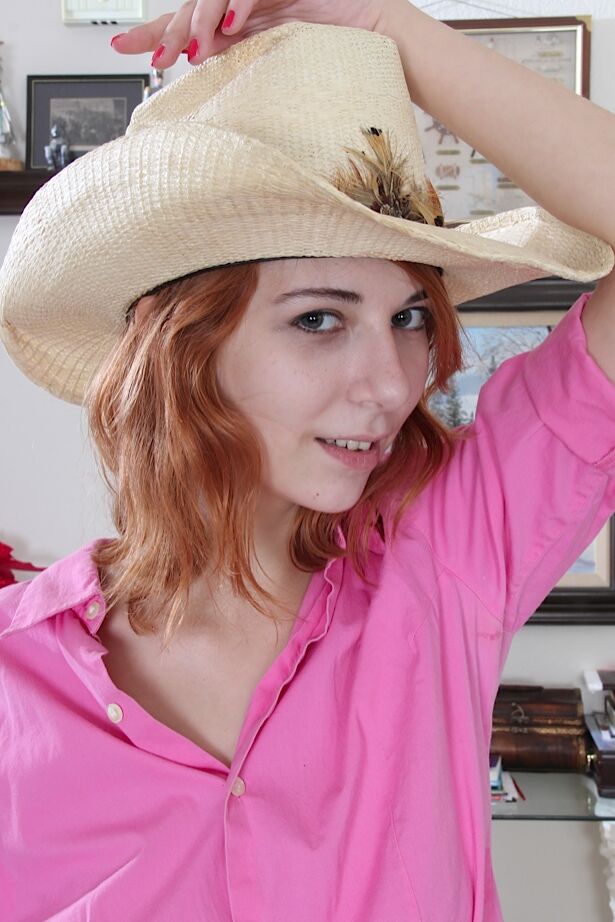 16P Amateur redhead Nancy Reid posing in cutoff shorts and cowgirl hat