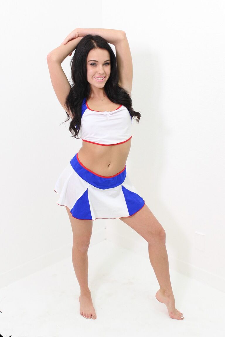 20P Dark-haired cheerleader Megan Rain works her phat ass while getting naked