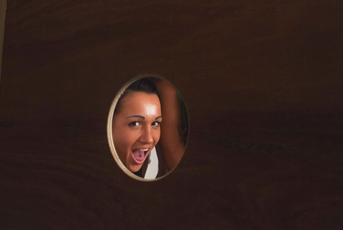 21P Clothed brunettes peek through the gloryhole and suck a stiff rod together