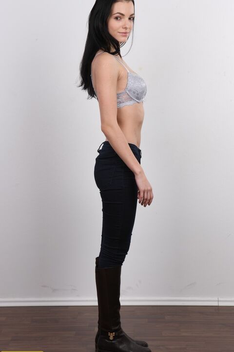 20P Dark-haired amateur Eva sports a nice smile while taking off all her clothes