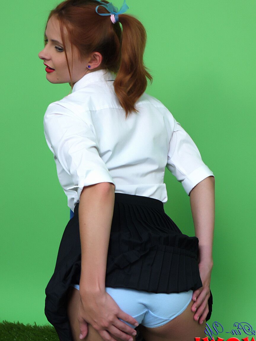 17P Cute redhead Elle Richie licks a lollipop before freeing big tits from uniform