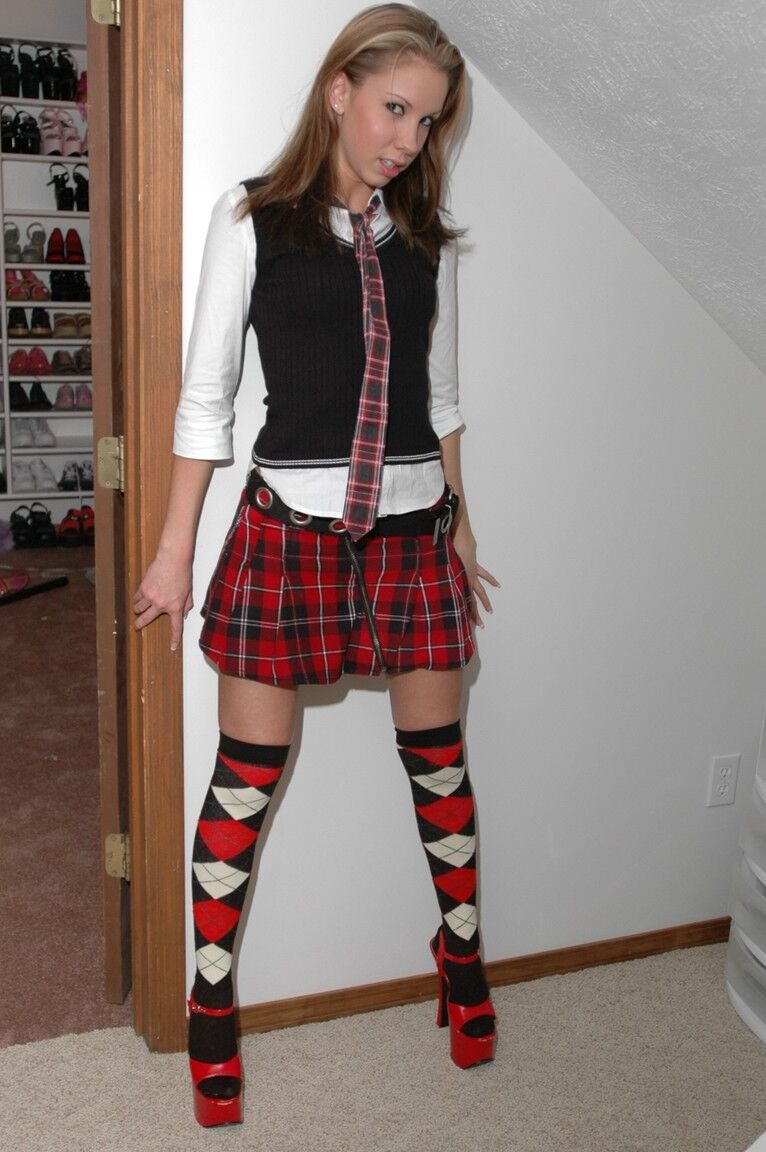 12P Amateur model shows her cute panties in OTK argyle socks and red heels