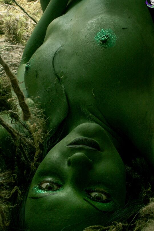 15P Solo girl with green skin wanders around the woods with no clothes on