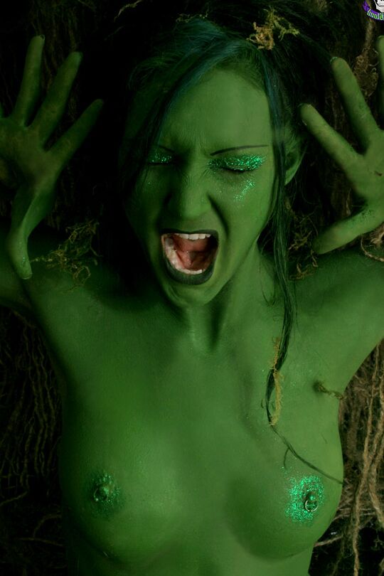 15P Solo girl with green skin wanders around the woods with no clothes on