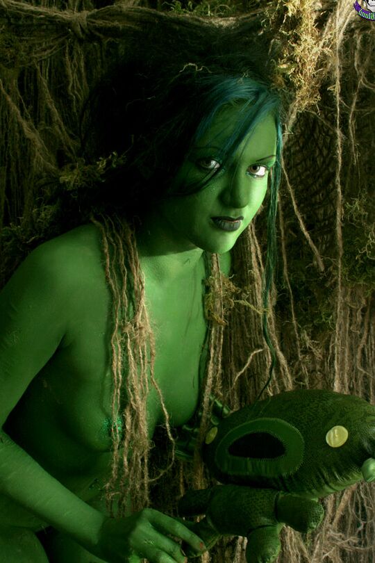 15P Solo girl with green skin wanders around the woods with no clothes on