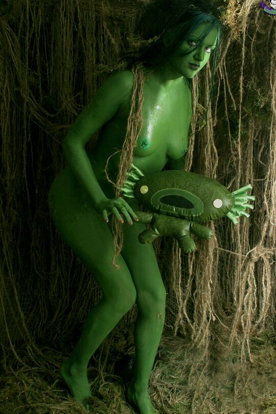 15P Solo girl with green skin wanders around the woods with no clothes on