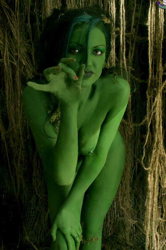 15P Solo girl with green skin wanders around the woods with no clothes on