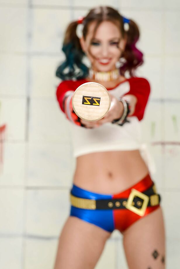 16P Cosplay attired model Riley Reid exposing tiny tits in pigtails and heels