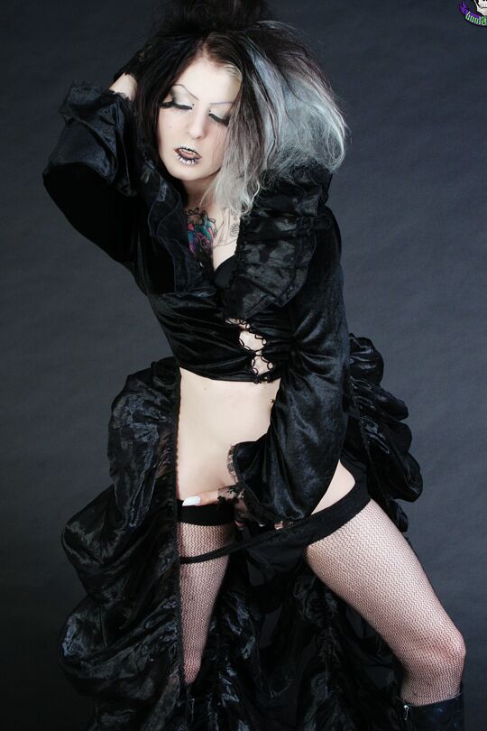 15P Goth girl Mad Sophie sports the Vampire look while exposing herself