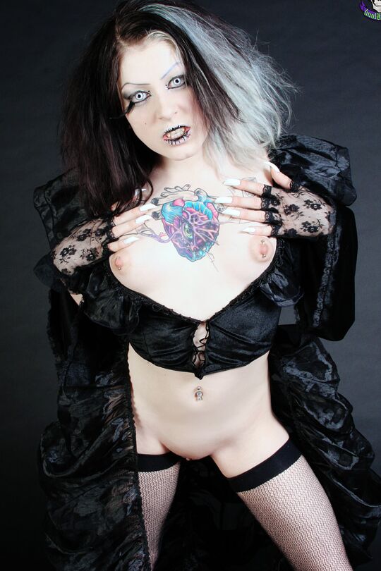 15P Goth girl Mad Sophie sports the Vampire look while exposing herself