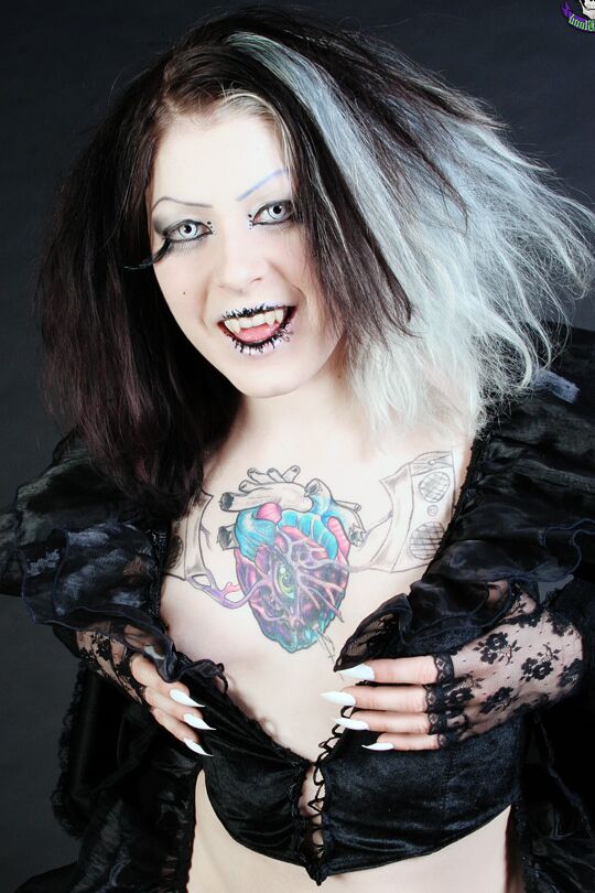 15P Goth girl Mad Sophie sports the Vampire look while exposing herself