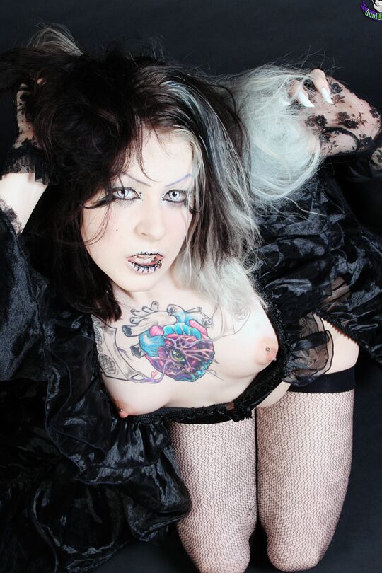 15P Goth girl Mad Sophie sports the Vampire look while exposing herself