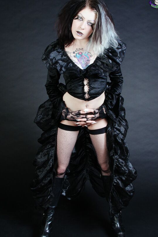 15P Goth girl Mad Sophie sports the Vampire look while exposing herself