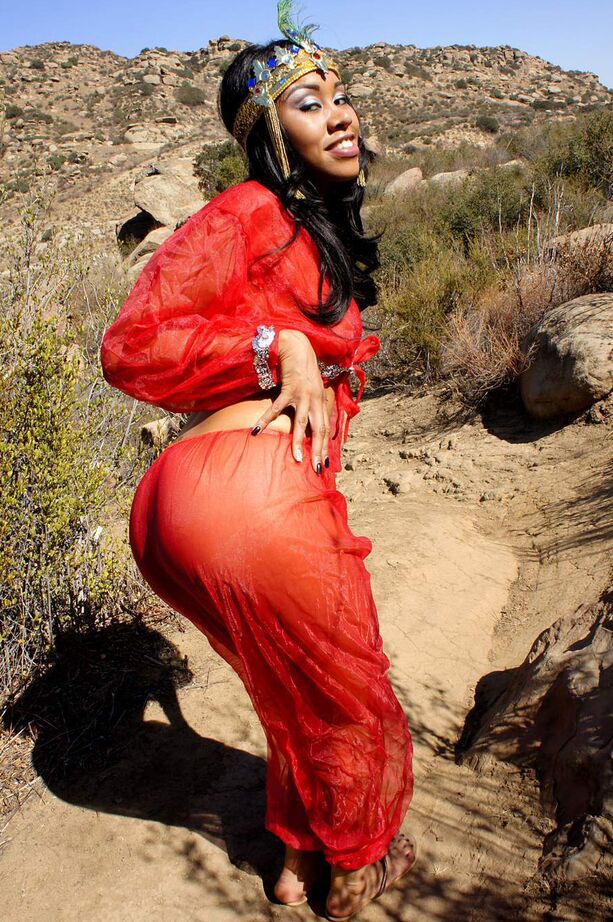 16P Black harem member Yasmine De Leon strips naked on a dirt trail thru the hills