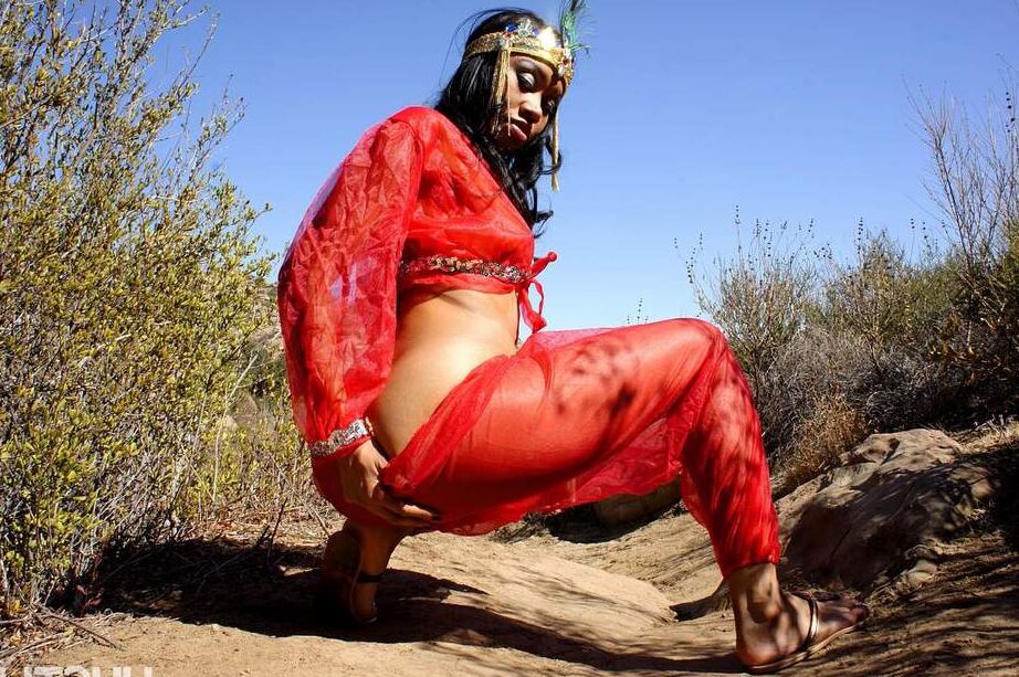 16P Black harem member Yasmine De Leon strips naked on a dirt trail thru the hills