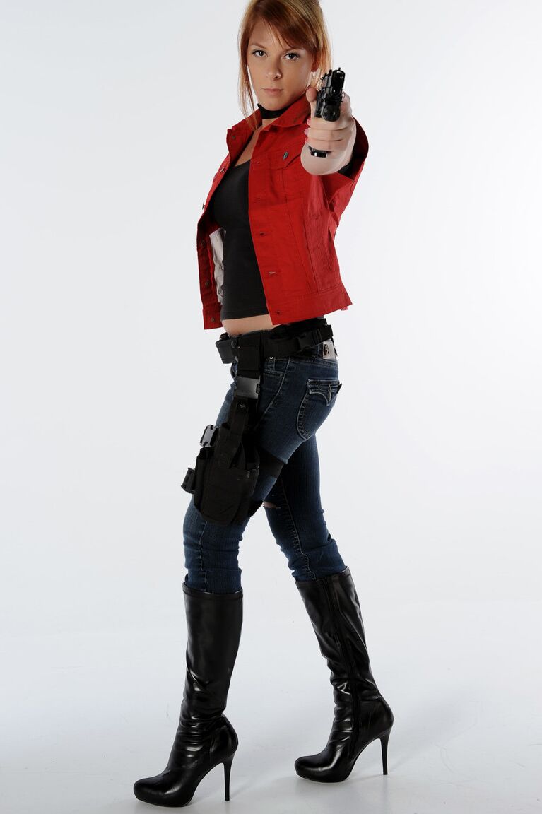 11P Solo girl Sophie wields a pistol while stripping to black boots