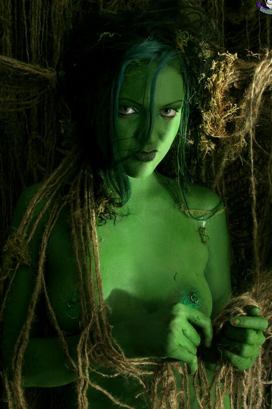 15P Female swamp creature emerges from the dark with no clothes on her naked body