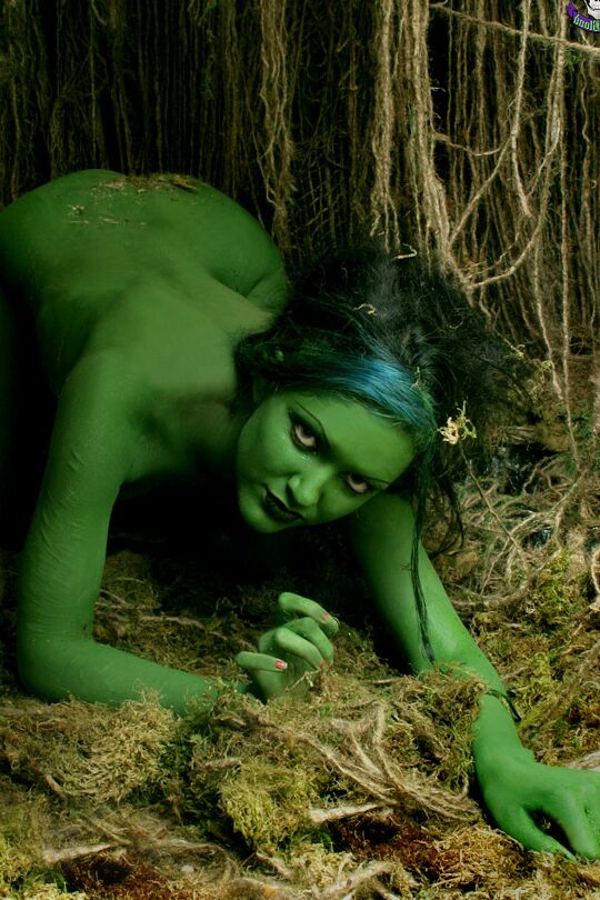 15P Female swamp creature emerges from the dark with no clothes on her naked body