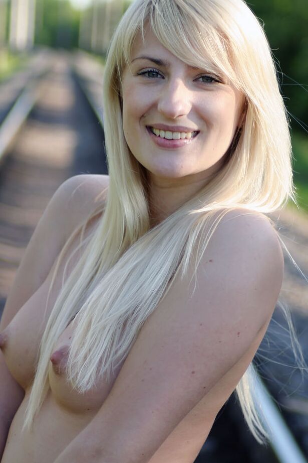 16P Leggy blonde Margo H strips to ankle strap heels on railway tracks