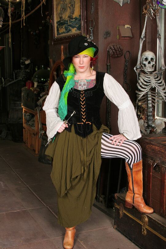 15P Tattooed redhead Zelda ditches pirate attire to pose nude in boots and a hat