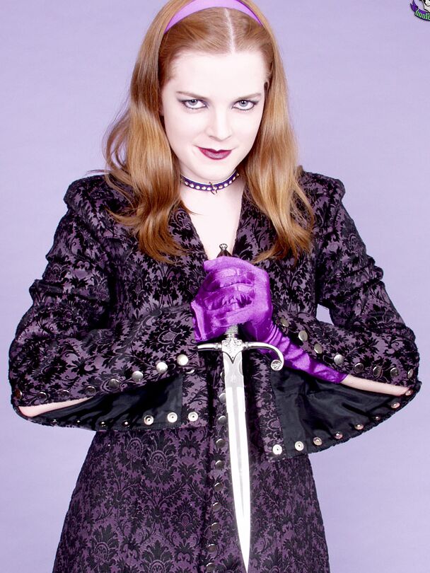 15P Pale redhead Keiko wields a dagger while getting naked in gloves and heels