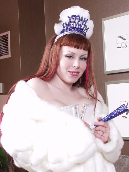 15P Redheaded goth Miss Bunny slips a party favour into her landing strip pussy