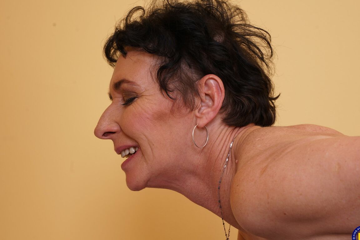 16P Horny cougar and her toy boy engage in foreplay as she they begin to undress