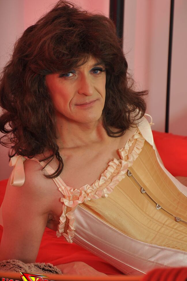 15P Curly haired crossdresser showing off her long legs and sexy natural curves