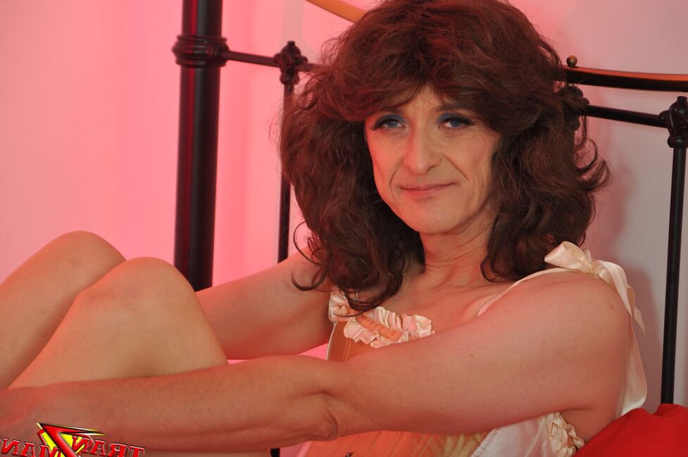 15P Curly haired crossdresser showing off her long legs and sexy natural curves