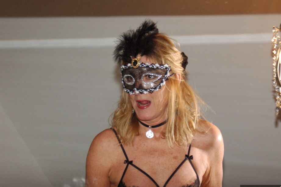 11P Older amateur removes a mask while wearing sheer lingerie and tan nylons