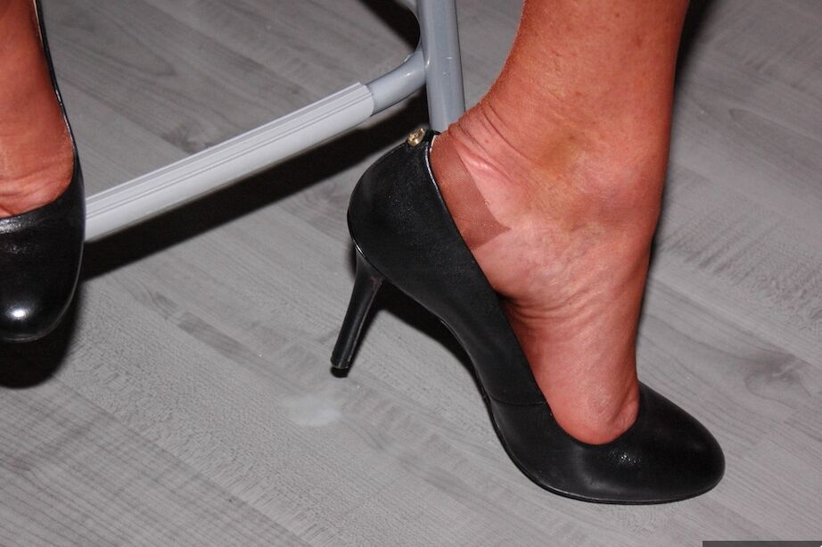11P Older amateur removes a mask while wearing sheer lingerie and tan nylons