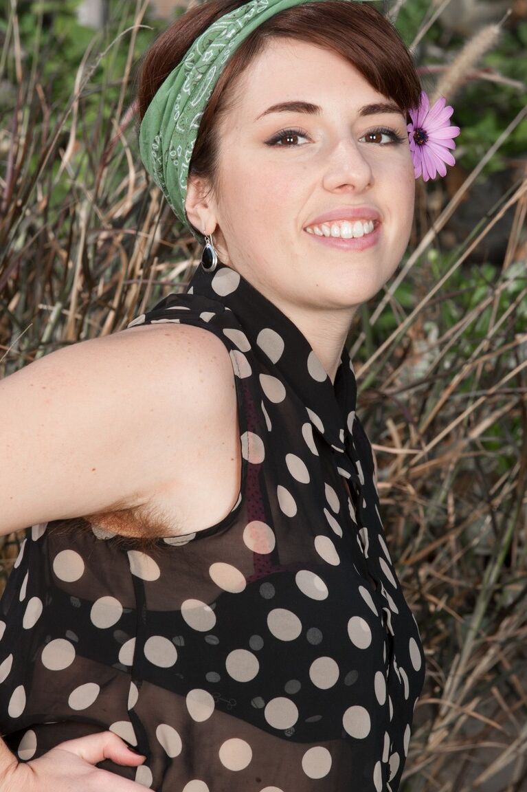 17P Chubby redhead Simone reveals her hairy legs and bushy cunt in the garden