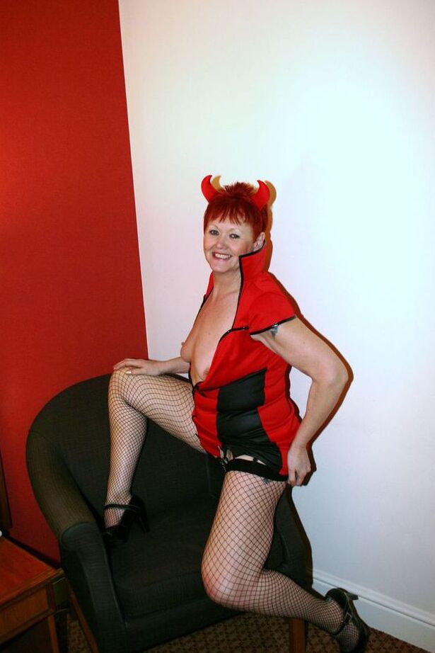 20P Older redhead Valgasmic Exposed exposes herself while wearing devil horns