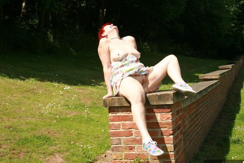 20P Older redhead Valgasmic Exposed gets totally naked in a public park