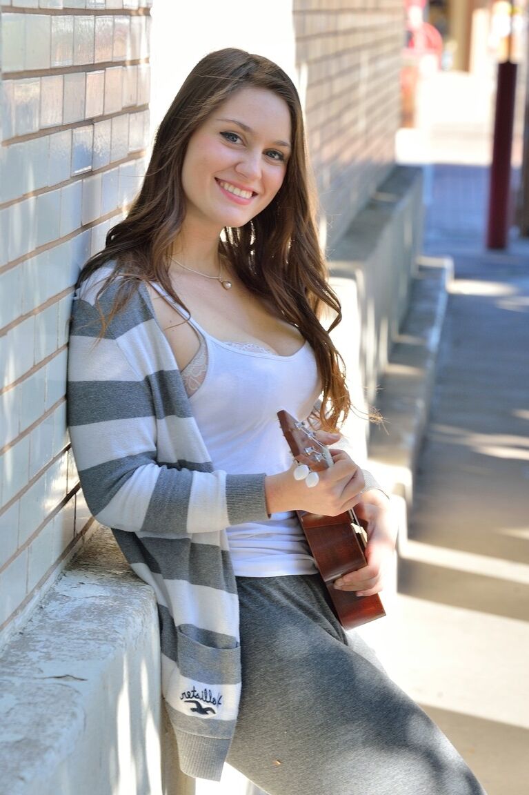 20P Bosomy babe Summer exposes her big ass while playing a small guitar in public