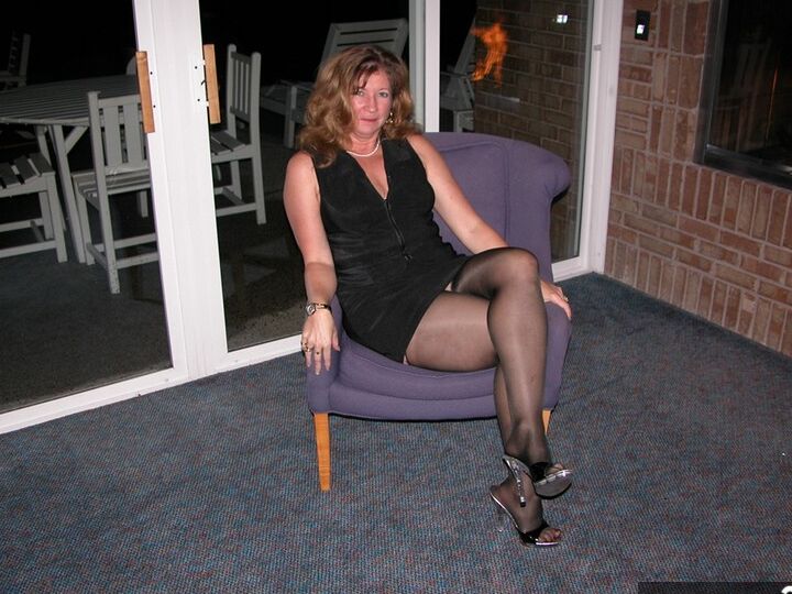 13P Mature woman Devlynn takes off her dress and heels while playing with her twat