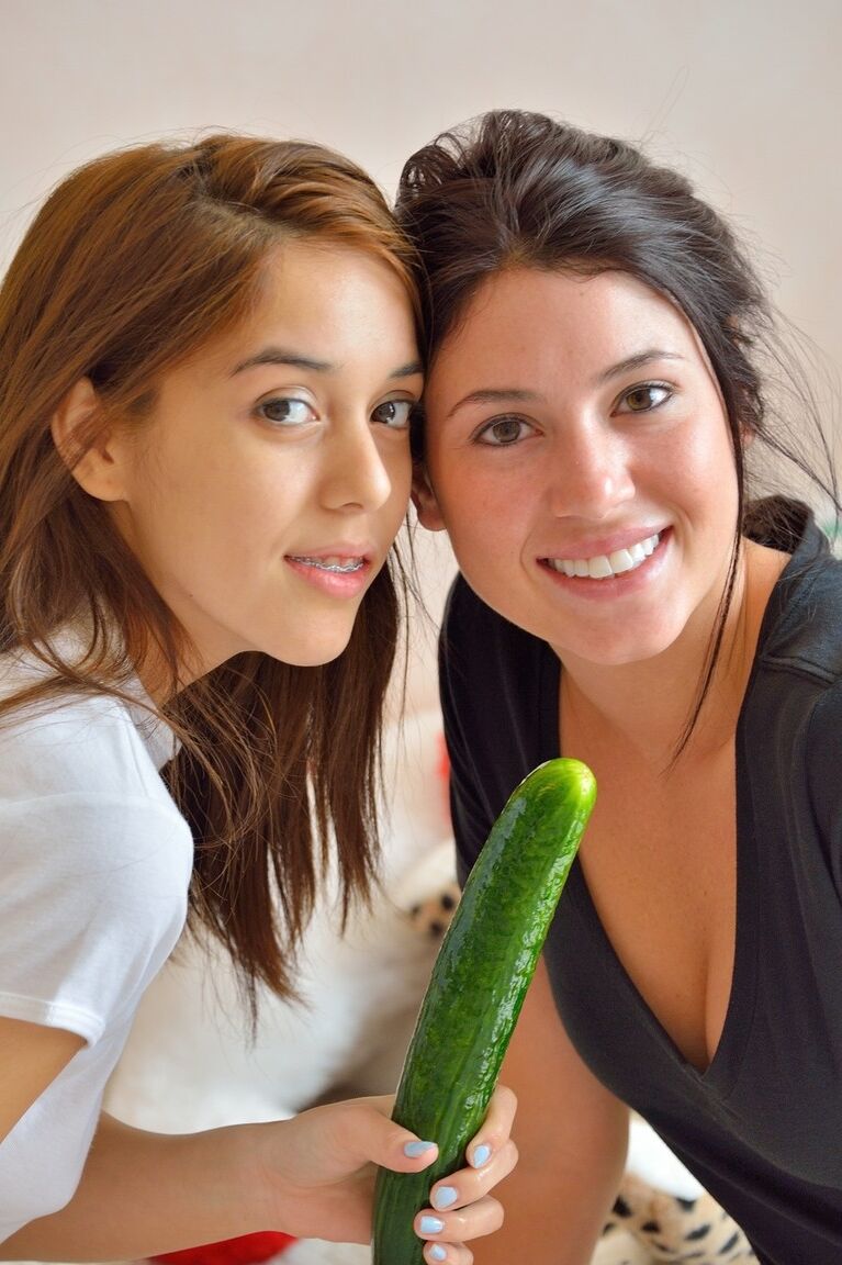 20P Sweet teen Sophie and her girlfriend play with a big green cucumber