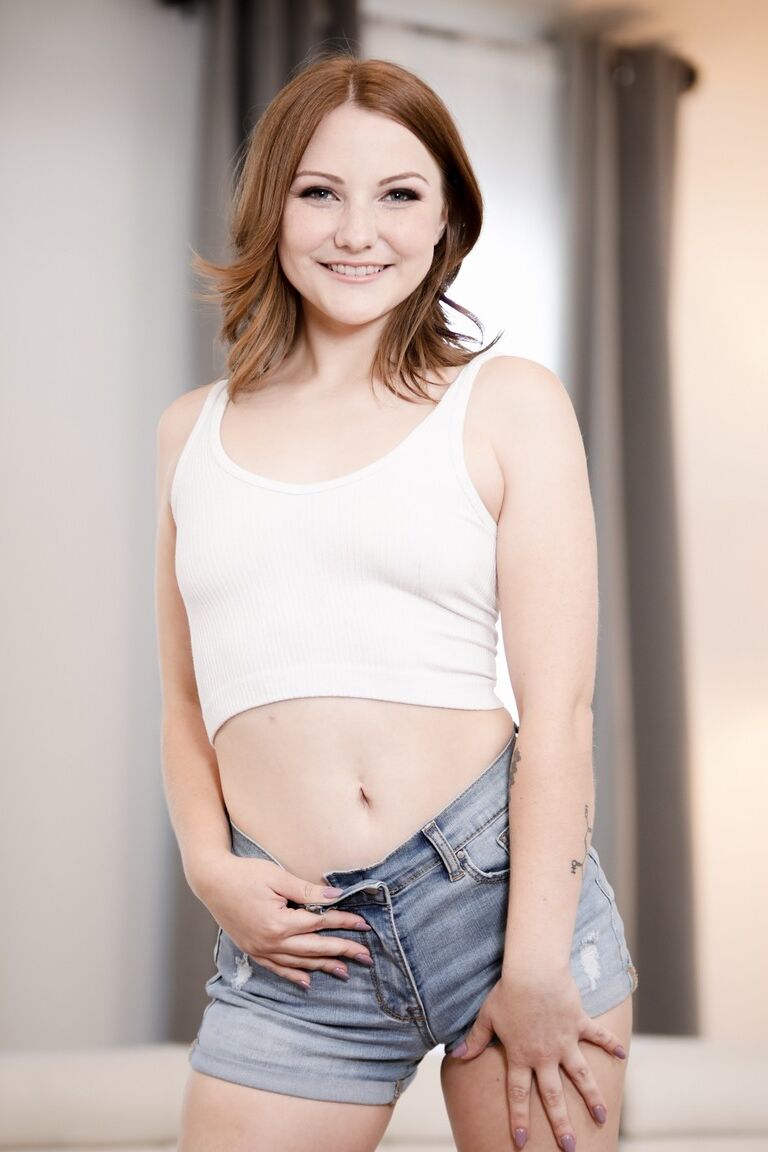15P Young redhead Jenna Clove takes it up the ass while having sex on a sofa