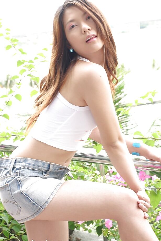 16P Seductive asian teen babe stripping and playing with a huge dildo