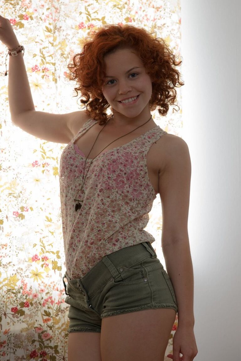 15P Young redhead with a hairy bush and curly hair gets banged on a futon