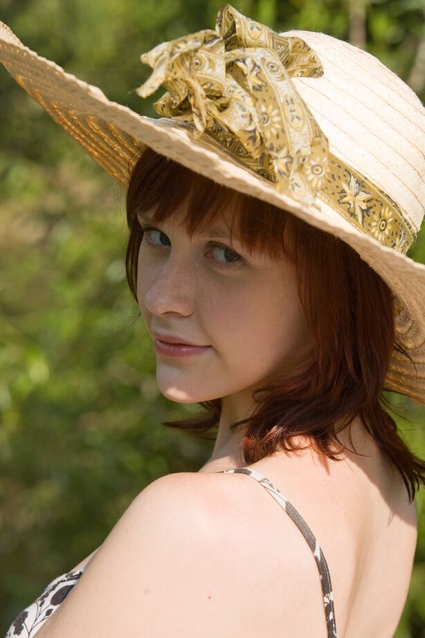 16P Cute redhead Anelie wades into a muddy stream while wearing no clothes