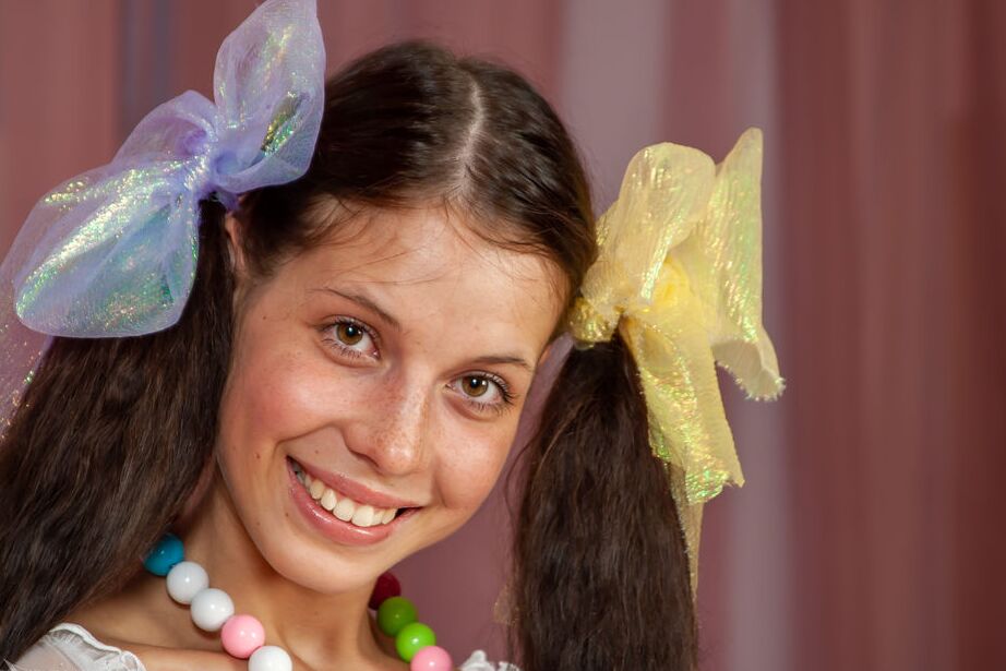 16P Young girl Anoushka E wears ribbon in her pigtails while sporting booty shorts