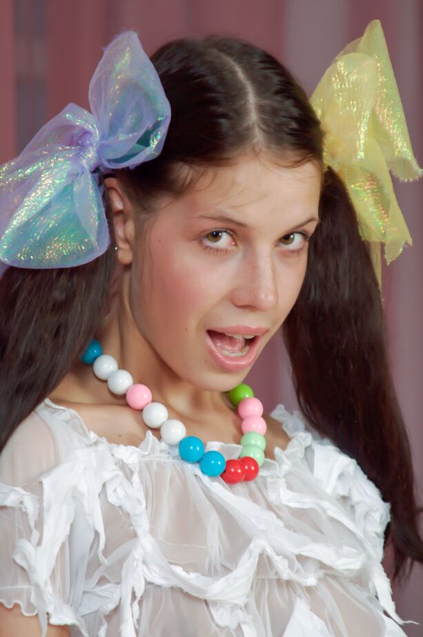 16P Young girl Anoushka E wears ribbon in her pigtails while sporting booty shorts